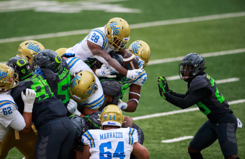 Graduate running back Brittain Brown goes high for a 2-yard rushing touchdown, reducing Oregon's lead early in the second half.