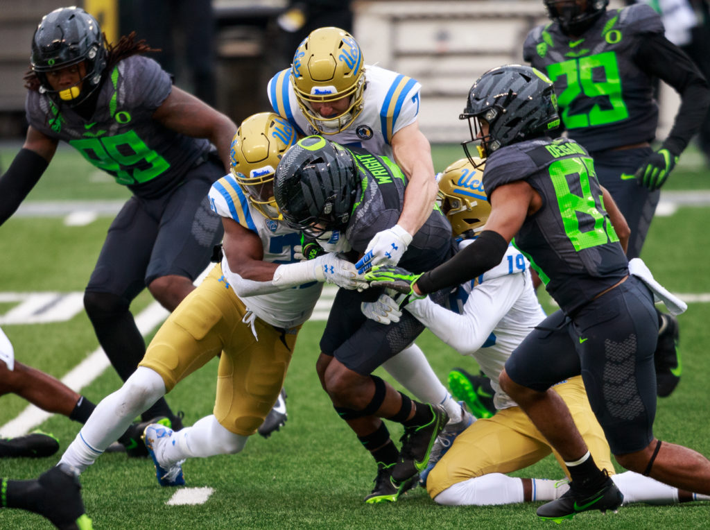Freshman defensive back Jonjon Vaughns and redshirt junior defensive back Mo Osling III tackle Oregon cornerback Mykael Wright on a kick return. The play was ruled as targeting, and Vaughns was ejected for the rest of the game.