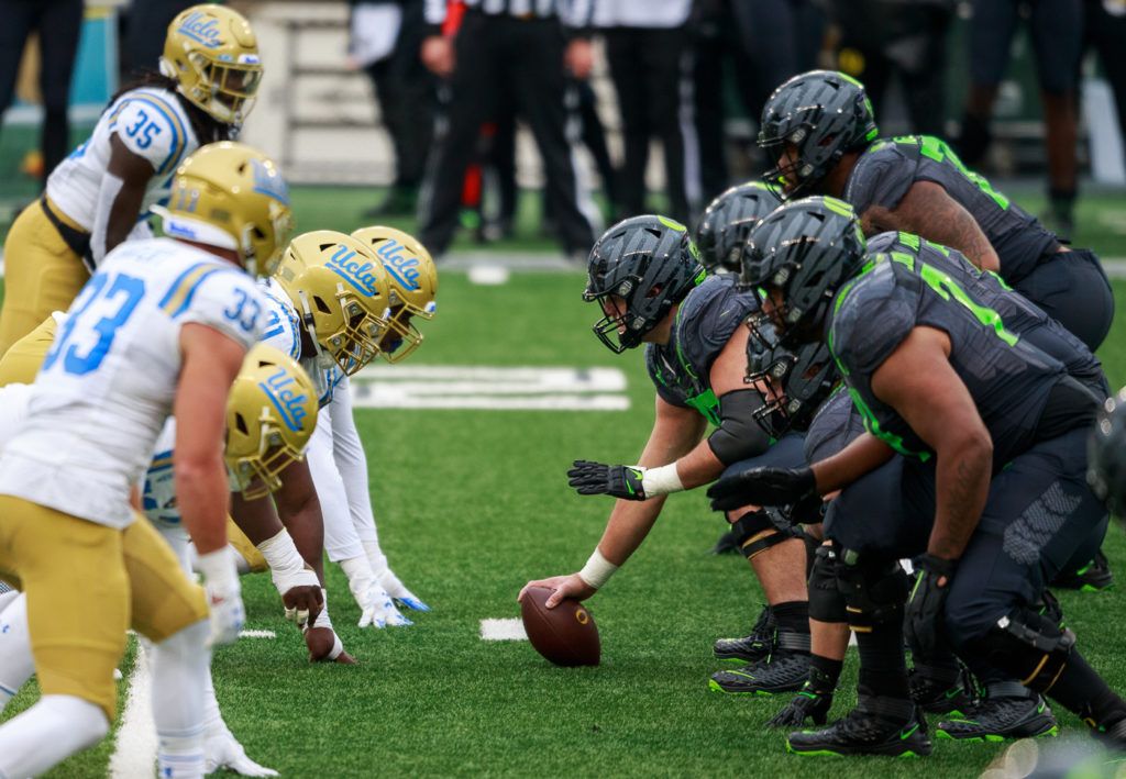 The Bruins' defense lines up against the Ducks' offense. UCLA held Oregon to just 422 yards, a season low.