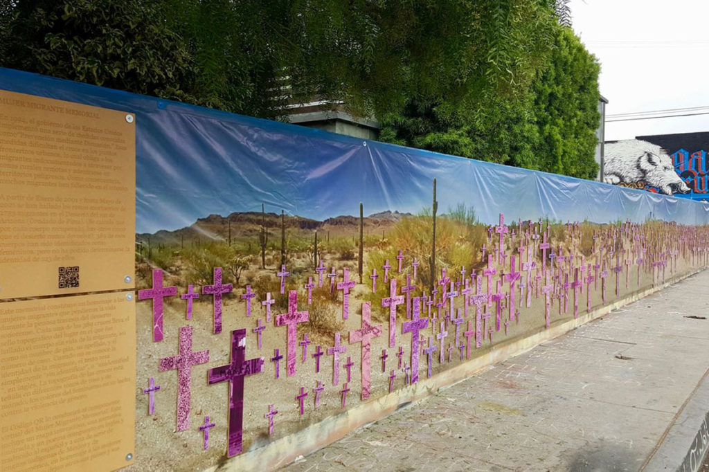 The Mujer Migrante Memorial mural can be found in Venice, CA, with named and unidentified crosses in shades of pink and purple that are joined by two panels of information. (Courtesy of Filomena Cruz)