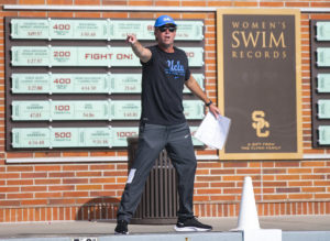 Coach Adam Wright argues with a referee. Wright was ejected late in the fourth quarter in No. 1 UCLA men’s water polo’s loss to No. 2 USC on Saturday.