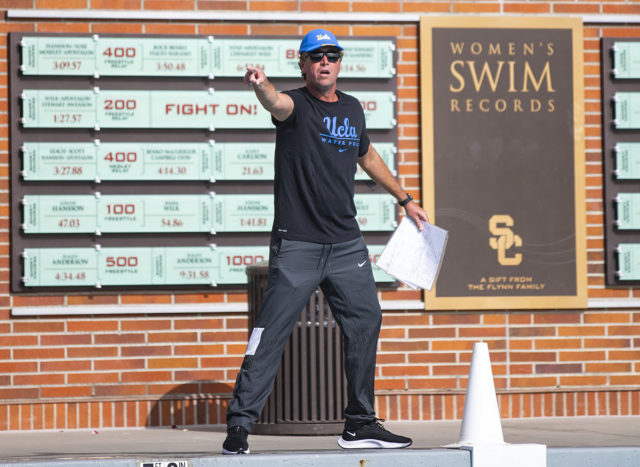 Coach Adam Wright argues with a referee. Wright was ejected late in the fourth quarter in No. 1 UCLA men’s water polo’s loss to No. 2 USC on Saturday.