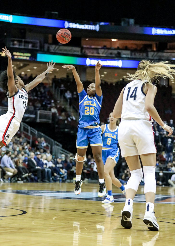 Osborne shoots a fast break 3-pointer over UConn guard Christyn Williams in the final minutes of the contest. 