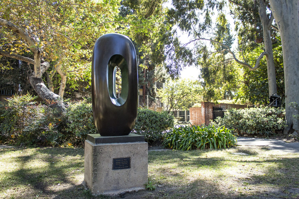 Sculptor Barbara Hepworth's Elegy III (Hollow Form with Color) was created in 1966 and now stands in UCLA's sculpture garden. (Jefferson Alade/Daily Bruin)