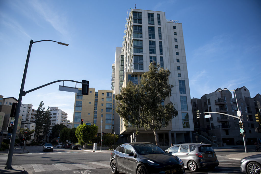 Westwood boasts a myriad of buildings new and old. Pictured is the new apartment building across from Westwood's Chevron gas station. (Ariana Fadel/Daily Bruin staff)
