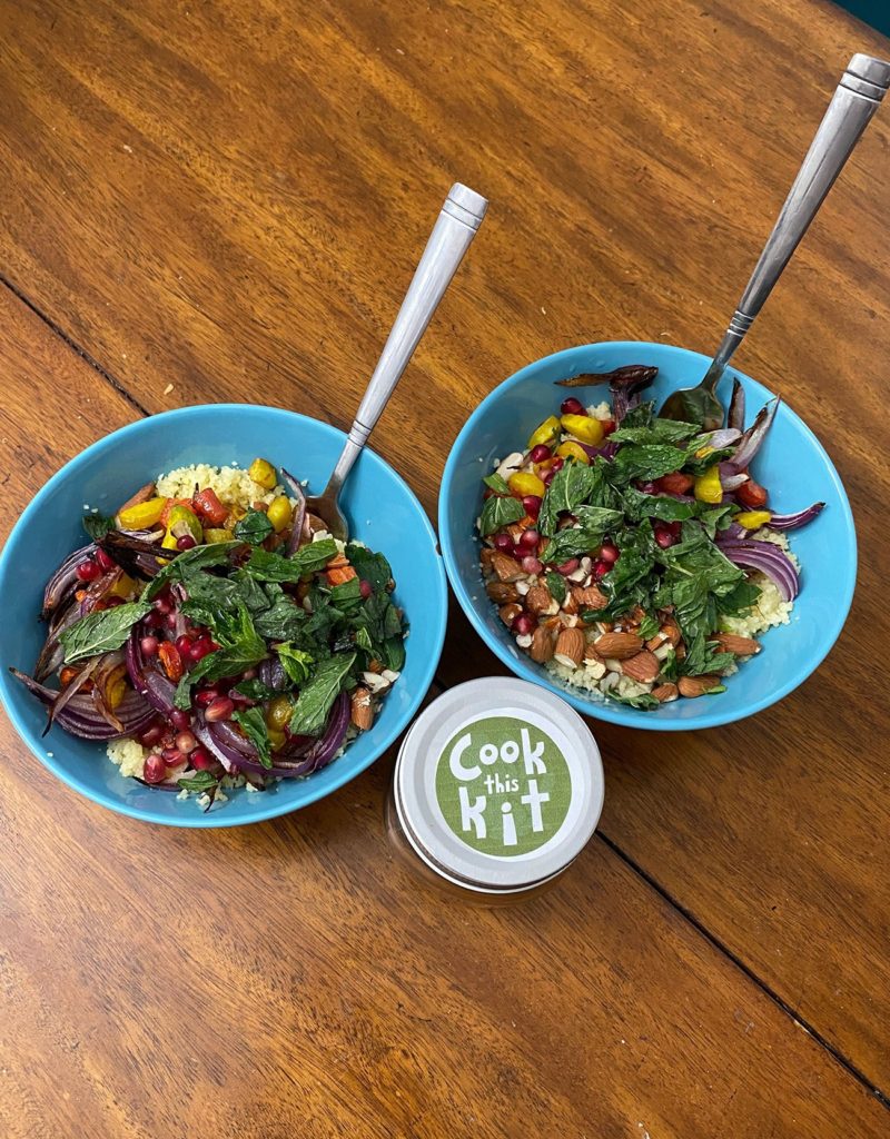 For Cook This Kit, Laila Adarkar said she started with a straightforward recipe containing ingredients that spanned the rainbow, pictured placed in blue bowls beside the Cook This Kit logo. As a pilot program, the kit was free and allowed patrons a chance to test it out and supply feedback. (Courtesy of Laila Adarkar)