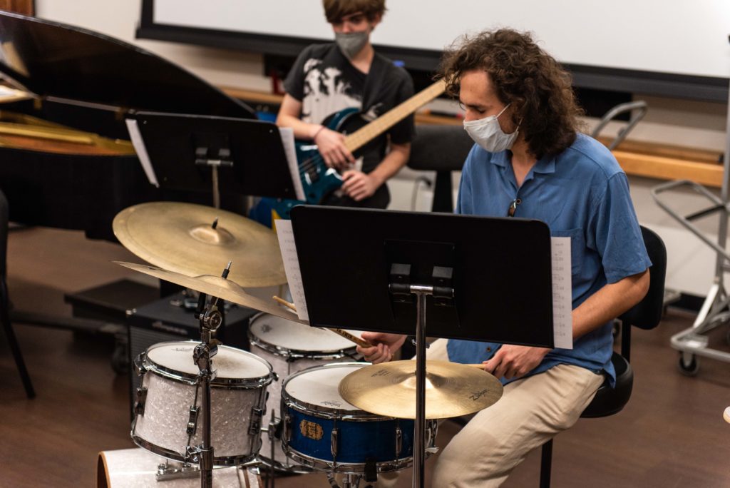 Playing with second-year global jazz studies student and bassist Matthew Wilson (left), fourth-year global jazz studies student and drummer in the Gluck Jazz Ensemble Liam Wallace (right) said he has formed personal connections and focused on his musical expression in the small, intimate nature of the jazz group. (August Suchecki/Daily Bruin)