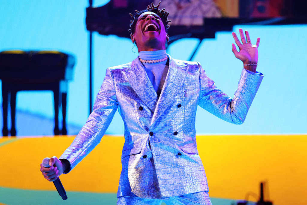 Jazz musician Jon Batiste joins the stage as one of the many performers with his rendition of “FREEDOM.” The artist came out on top in nominations and awards during Sunday's festivities, totaling five out of 11, including the ceremony’s final award, album of the year, for “WE ARE.” (Courtesy of Getty Images for The Recording Academy)