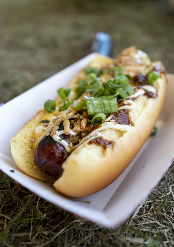 A hot dog from Sumo Dogs is garnished with various toppings. The vendor offered three types of the American staple as well as tater tots, but each featured a Japanese-inspired twist. (Ashley Kenney/Photo editor)