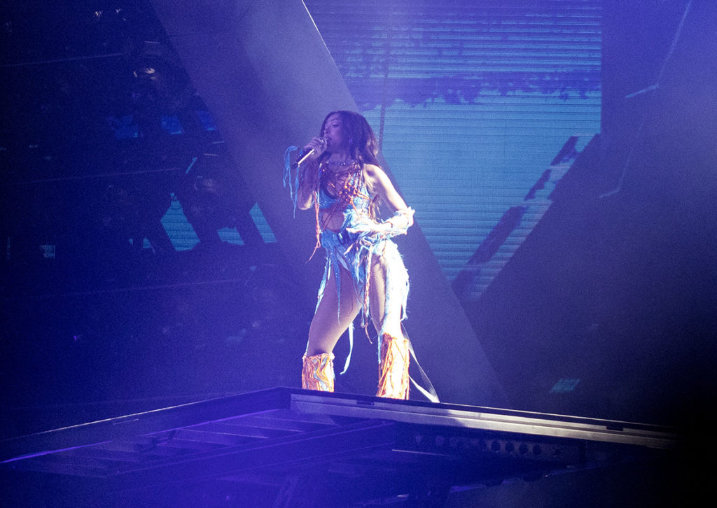 Doja Cat stands on a platform wearing a strappy outfit. The artist performed an unreleased track, "Shots," as well as a nod to breakout track "MOOO!" (Ashley Kenney/Photo editor)