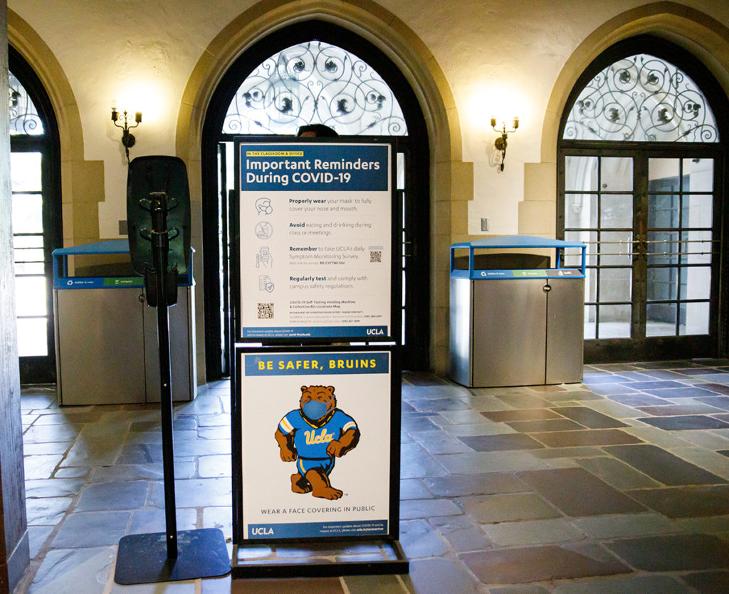 COVID-19 reminders are stationed around campus to remind Bruins of UCLA's safety measures. The Quad hears from students, staff and local Los Angeles officials regarding how they feel about the lifting of the mask mandate as of Apr. 11. (Sakshi Joglekar/Assistant Photo editor)