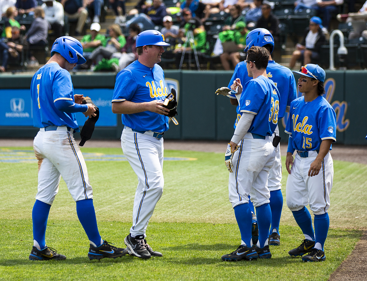 Jared Karros (19) of the UCLA Bruins pitches against the USC