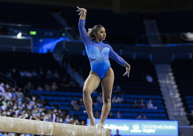 Freshman Jordan Chiles performs on beam. Chiles posted a 39.525 in the all-around Saturday but No. 14 UCLA gymnastics failed to advance to the NCAA championships. (Ashley Kenney/Photo editor)