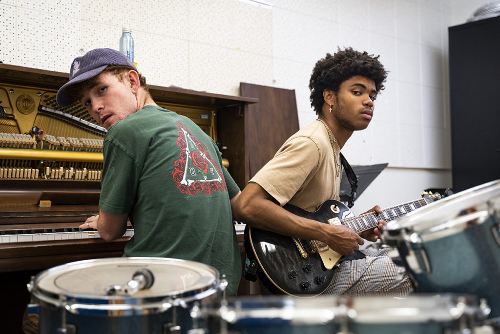 Filiz (left) and Lawson (right) sit back to back with Filiz playing piano and Lawson on bass. The duo will infuse R&B and alternative elements as they perform their song "Lucid" at Spring Sing. (Nina Morasky/Daily Bruin)