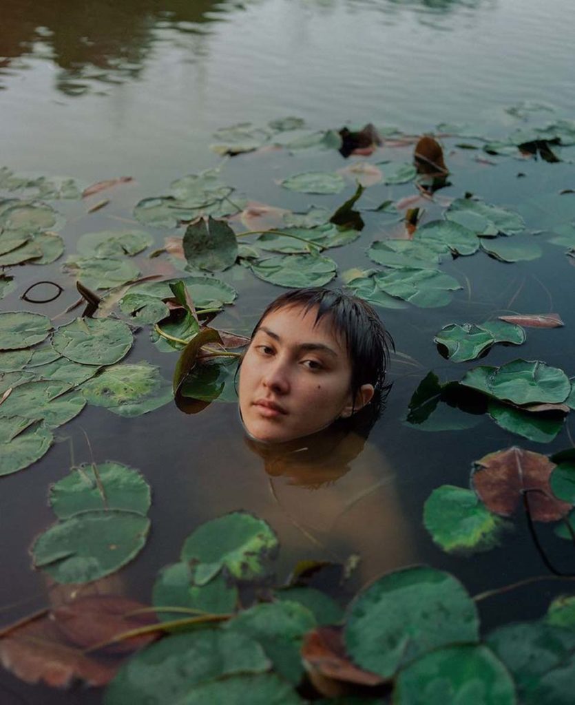 Head above water, Yang's subject is photographed submerged, surrounded by lily pads. Yang said photographing subjects in natural settings allows for more authenticity in their pieces. (Courtesy of Sey Yang)