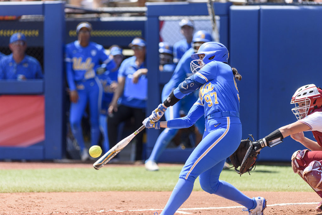 Redshirt senior infielder Delanie Wisz hits the ball. Wisz swung for a two-RBI home run in the first inning – the first of three UCLA homers in the contest.