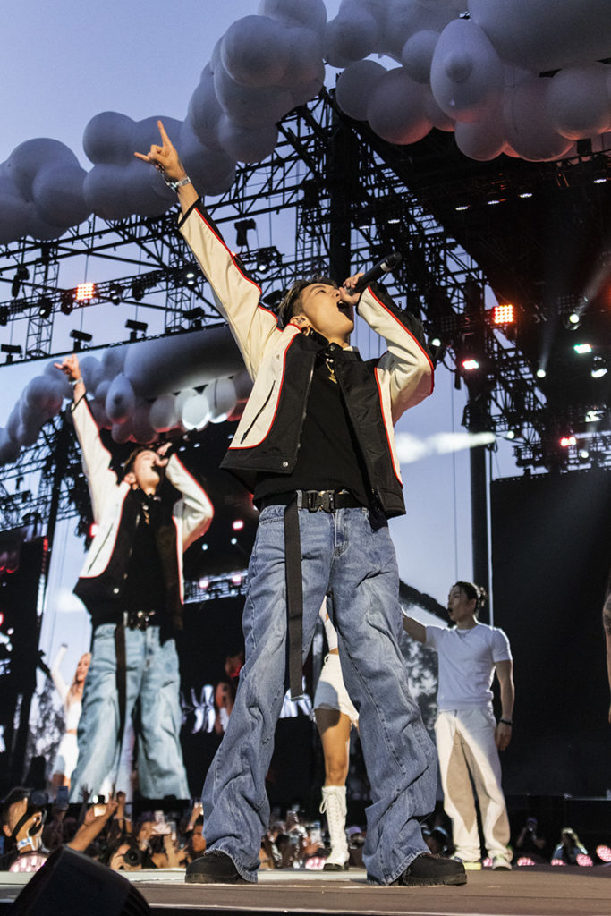 Wearing a black, white and red jacket, Jay Park sings into his mic while pointing to the sky. In addition to performing solo tracks, Park's set featured performances from rappers Sik-K and pH-1. (Megan Cai/Assistant Photo editor)