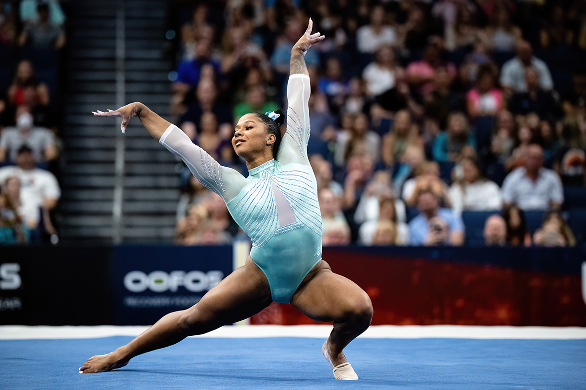 Senior Emily Eadens poses at the end of her floor routine. Photo by Evelyn  Roesner | The Harbinger Online