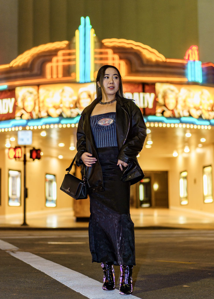 Ada Chung looks off to the side while posing in front of the Regency Bruin Theatre. She said her self-confidence has grown since she first started creating fashion content. (Brandon Morquecho/Daily Bruin)