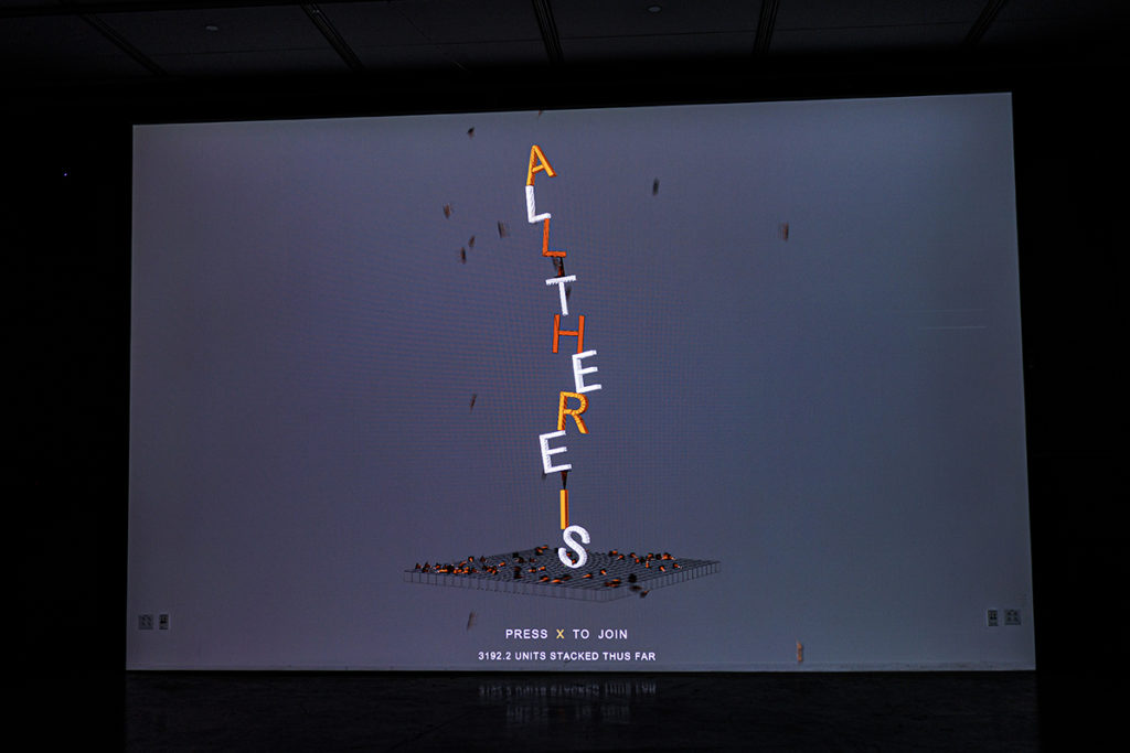 Orange, white and red stacked letters spell out "ALL THERE IS" on the game&squot;s starting screen. In the game, players are able to enter objects and stack surrounding items. (Neha Krishnakumar/Daily Bruin)