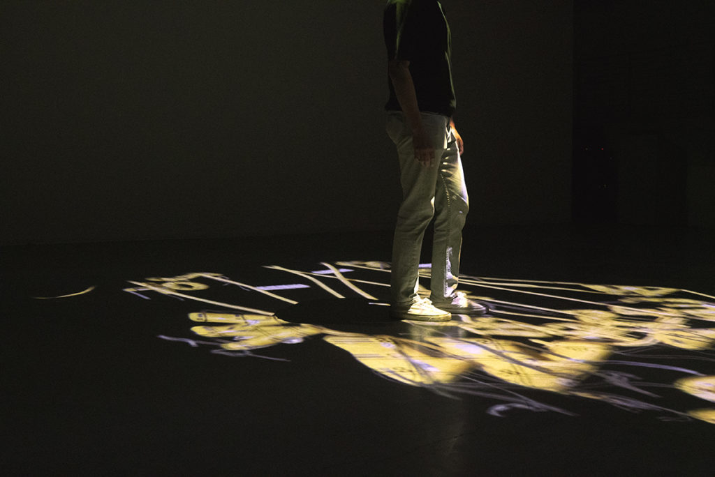 "Drift" is projected on the floor of a dark room. Kim said his experiences deeply inspire his multimedia works. Through artistically expressing these emotions, such as the isolation he said he felt after moving from Seoul to Los Angeles, he hopes to invoke a sense of community and hope in viewers with similar experiences. (Courtesy of Doyeon Kim)