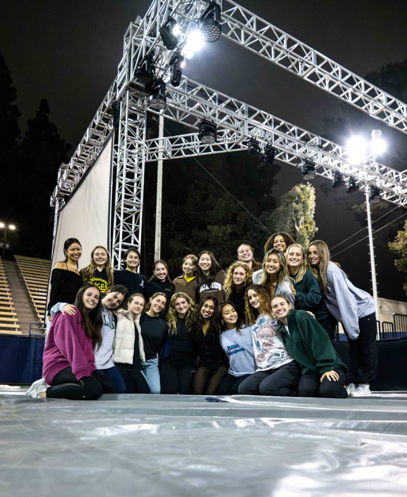 Members of Icarus sit together on the floor of the Los Angeles Tennis Center. The group's performance at this year's Spring Sing will be set to a medley of songs by Beyoncé. (Jenny Xu/Daily Bruin)