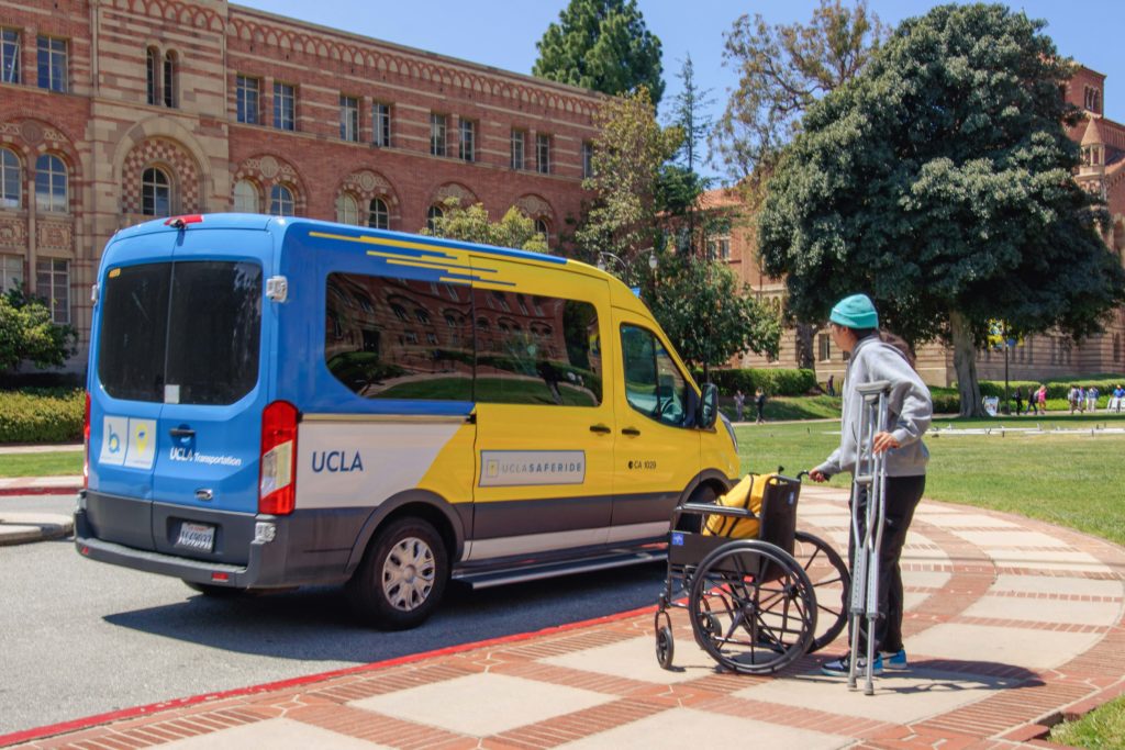 Paago waits to board a BruinAccess van. She said her experience at UCLA is different from UC Irvine, where students with disabilities are driven in golf carts to and from their classes. (Javier Jauregui Ramirez/Daily Bruin)
