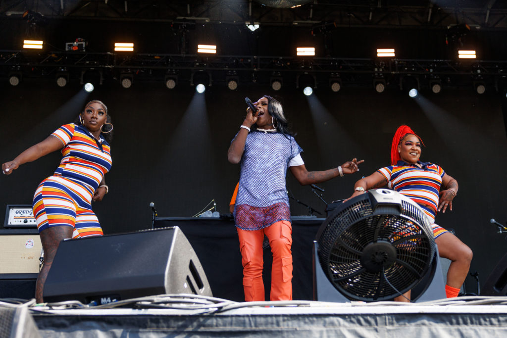 Dressed in blue and orange, Big Freedia stands center stage with backup dancers on each side. The artist&squot;s setlist included covers and original tracks, as Big Freedia and their "Bounce Ambassadors." twerked on the stage. (Anika Chakrabarti/Photo editor)