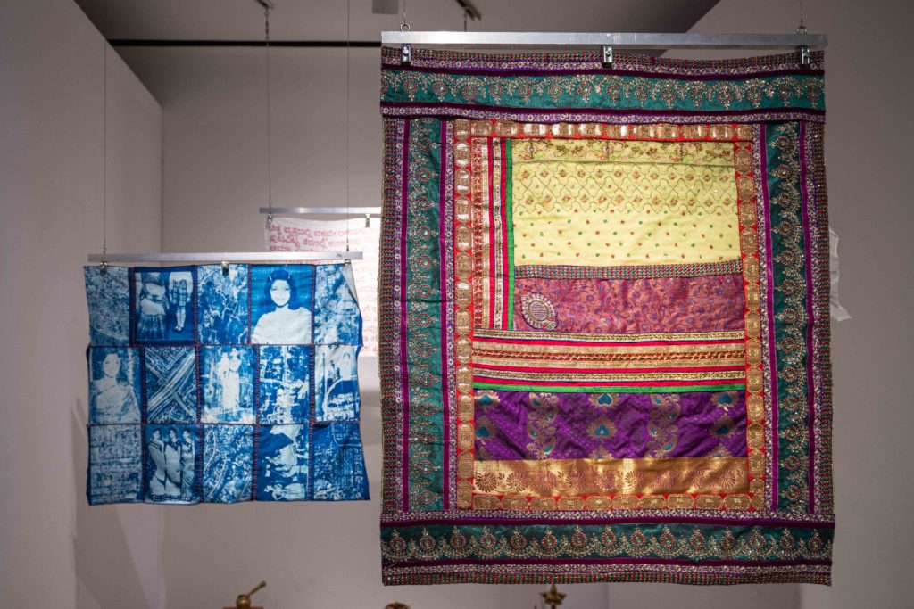 Anika Murthy&squot;s three tapestries incorporate cyanotype photographs, embroidery and jewel-toned traditional clothing as part of "A Tapestry is a Timeline." Murthy said the piece is dedicated to her South Asian heritage and matriarchal lineages. (Brandon Morquecho/Assistant Photo editor)