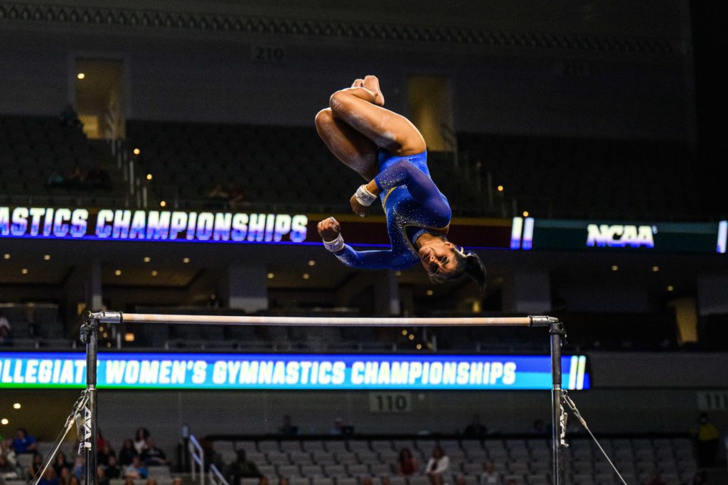 Chiles dismounts on bars. She claimed the individual title on bars at the NCAA championships. (Anika Chakrabarti/Daily Bruin senior staff)