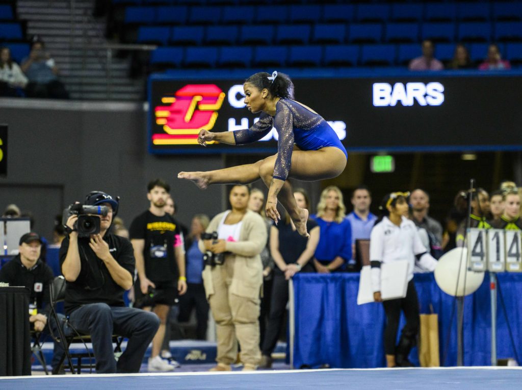 Jordan Chiles performs her floor routine at the NCAA Los Angeles Regional. Chiles finished the 2023 season with two individual NCAA titles. (Jeremy Chen/Daily Bruin senior staff)