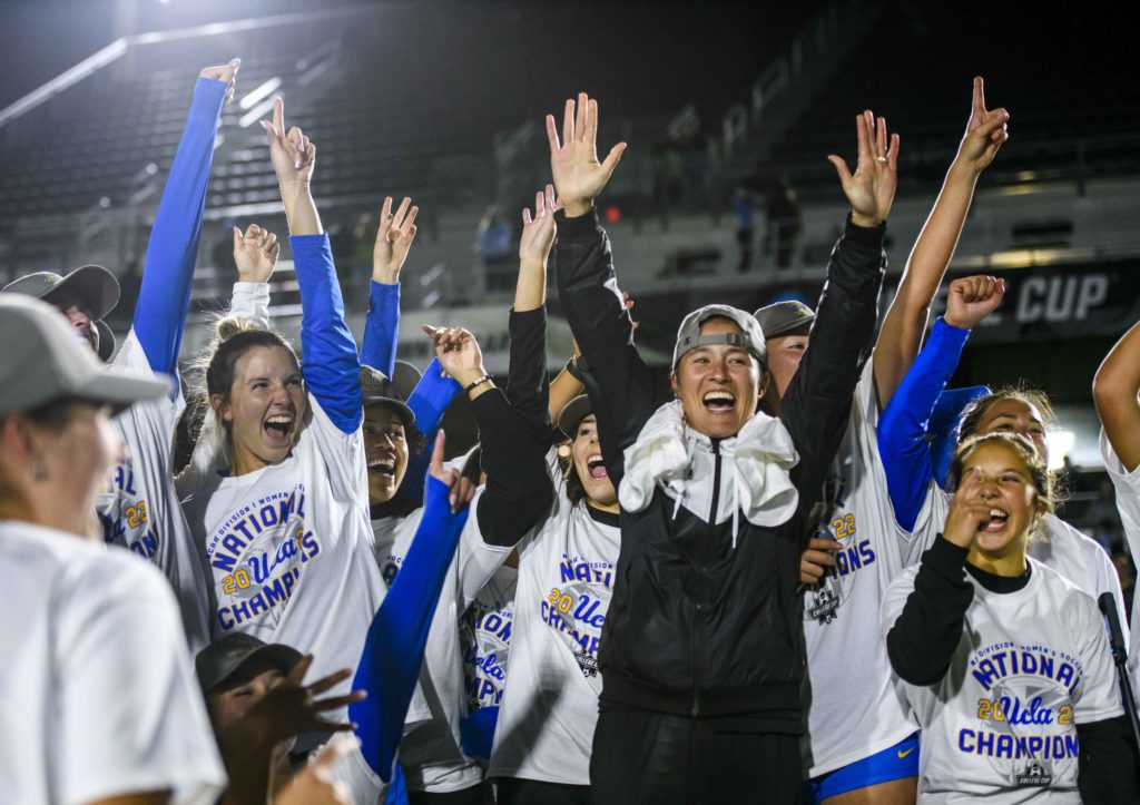 Coach Margueritte Aozasa celebrates with her players after their victory over North Carolina to claim the national championship. Aozasa made history as the first ever rookie coach to win a D1 women’s soccer title. (Christine Kao/Daily Bruin staff)