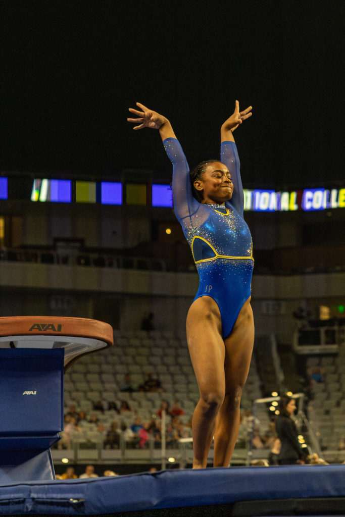 UCLA gymnastics freshman Selena Harris salutes the judges on her vault at the NCAA Los Angeles Regional Final. Harris' first-career perfect 10 on vault cemented the Bruins' spot in the NCAA Championships for the first time since 2019. (Anika Chakrabarti/Daily Bruin senior staff)