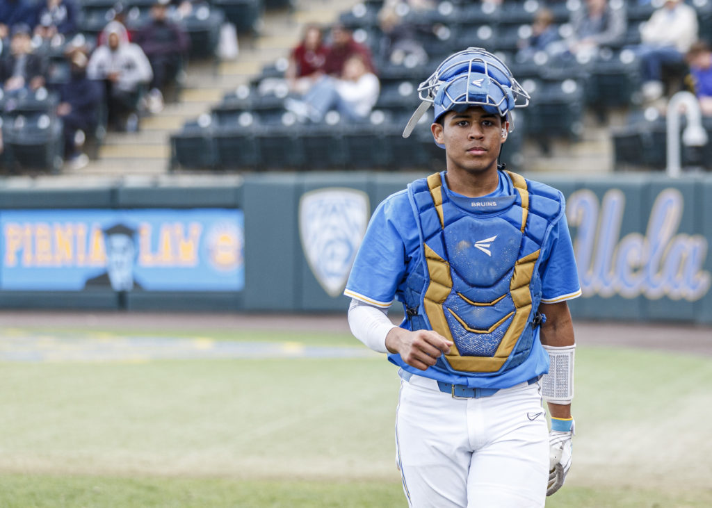 Catcher Darius Perry walks towards the home dugout. (Joseph Jimenez/Photo editor)