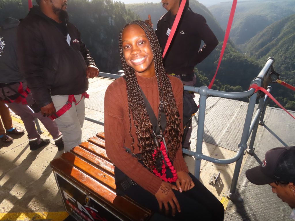 Laila Wheeler (pictured) smiles for a portrait in her bungy jumping gear. (Courtesy of Face Adrenalin Bungy)