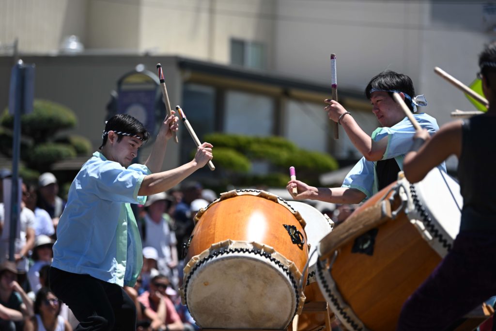 Barrett Koontz (left) and Taylor Lee (right) lift their arms to strike a drum. Rising fourth-year global jazz studies student Koontz said Yukai members produce alternative and fundamental sounds through their blend of contemporary and traditional drumming styles. (Courtesy of Riley Stokes)