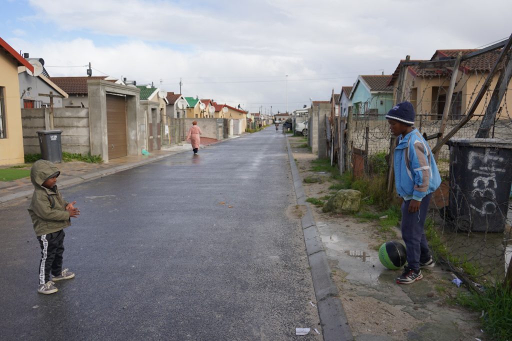 Two children play with a ball in Khayelitsha. (Courtesy of Sam Henry)