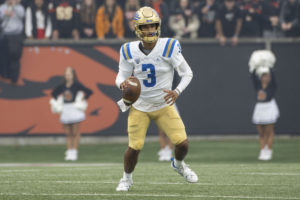 Freshman quarterback Dante Moore holds the ball during UCLA football’s game against Oregon State. The Bruins’ contest against the Beavers was the final game Moore started, and he played in three more games off the bench. (Brandon Morquecho/Assistant Photo editor)