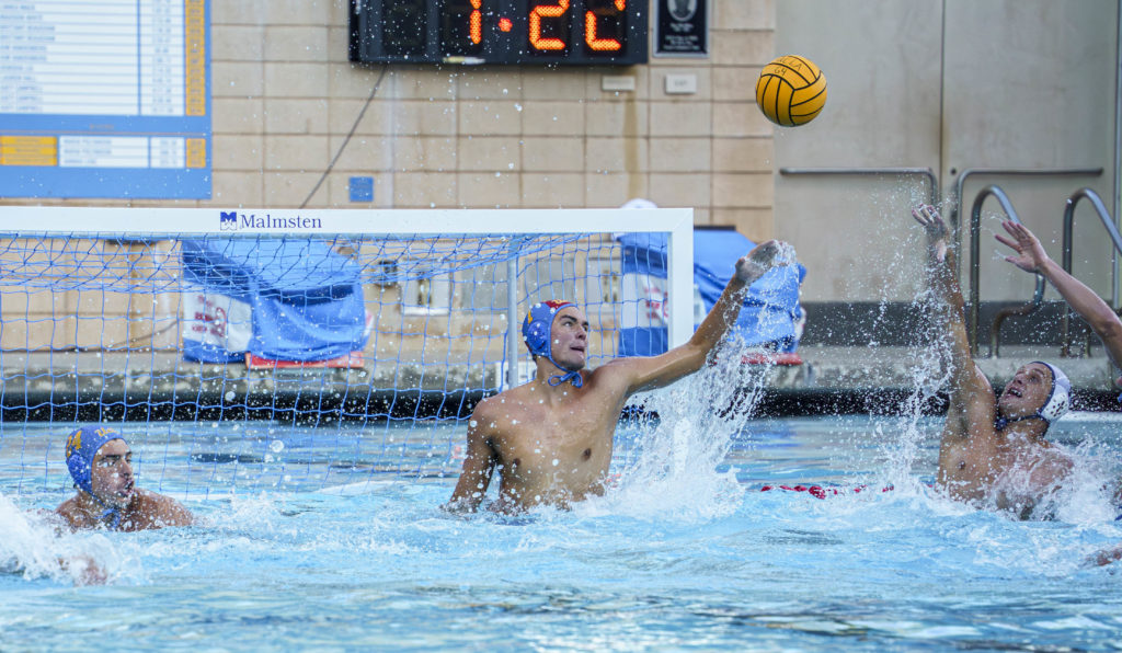 Senior goalkeeper Garret Griggs watches the ball soar over the goal at Spieker Aquatics Center on Friday. Griggs, who was honored alongside his fellow seniors before the game, recorded nine saves against UC Irvine. (Julia Zhou/Assistant Photo editor)