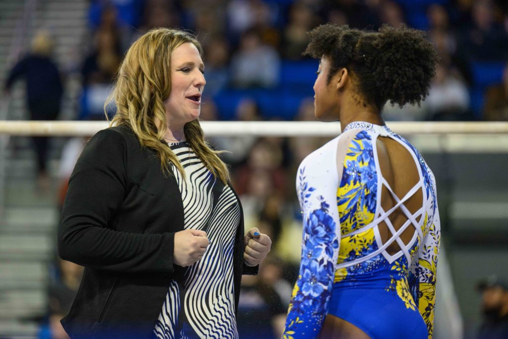 McDonald conducts a pep talk with sophomore Maddie Anyimi at Pauley Pavilion. (Jeremy Chen/Photo editor)
