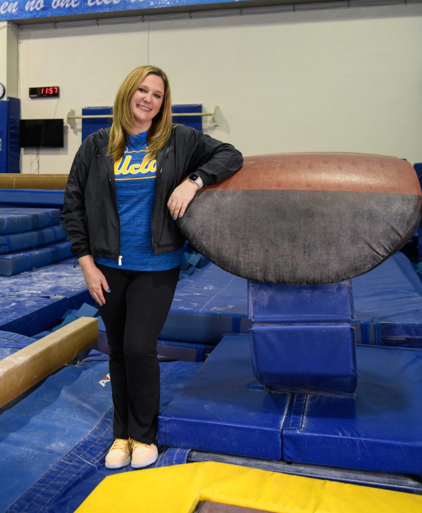 McDonald leans against the springboard at the vaulting practice area at Yates Gym. (Jake Greenberg-Bell/Daily Bruin staff)