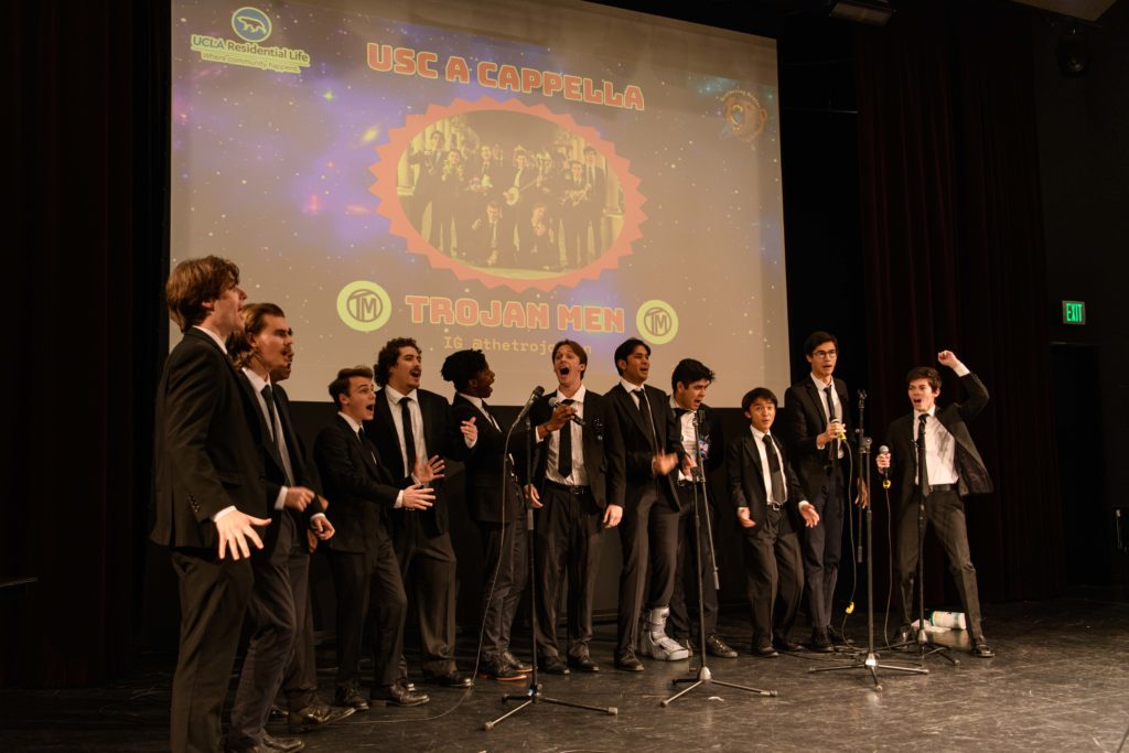 USC's all male a cappella group, The Trojan Men, perform a series of songs while dressed in black suits. Its set included a mix of Elvis Presley songs accompanied by dance moves inspired by the musician. (Nicolas Greamo/Daily Bruin senior staff)