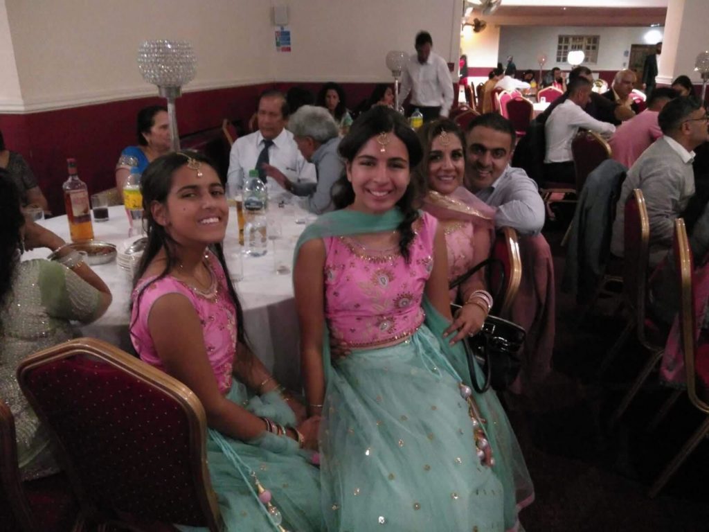 Ria Sanghera and her family smile for a photo at a Punjabi wedding. (Courtesy of Ria Sanghera)