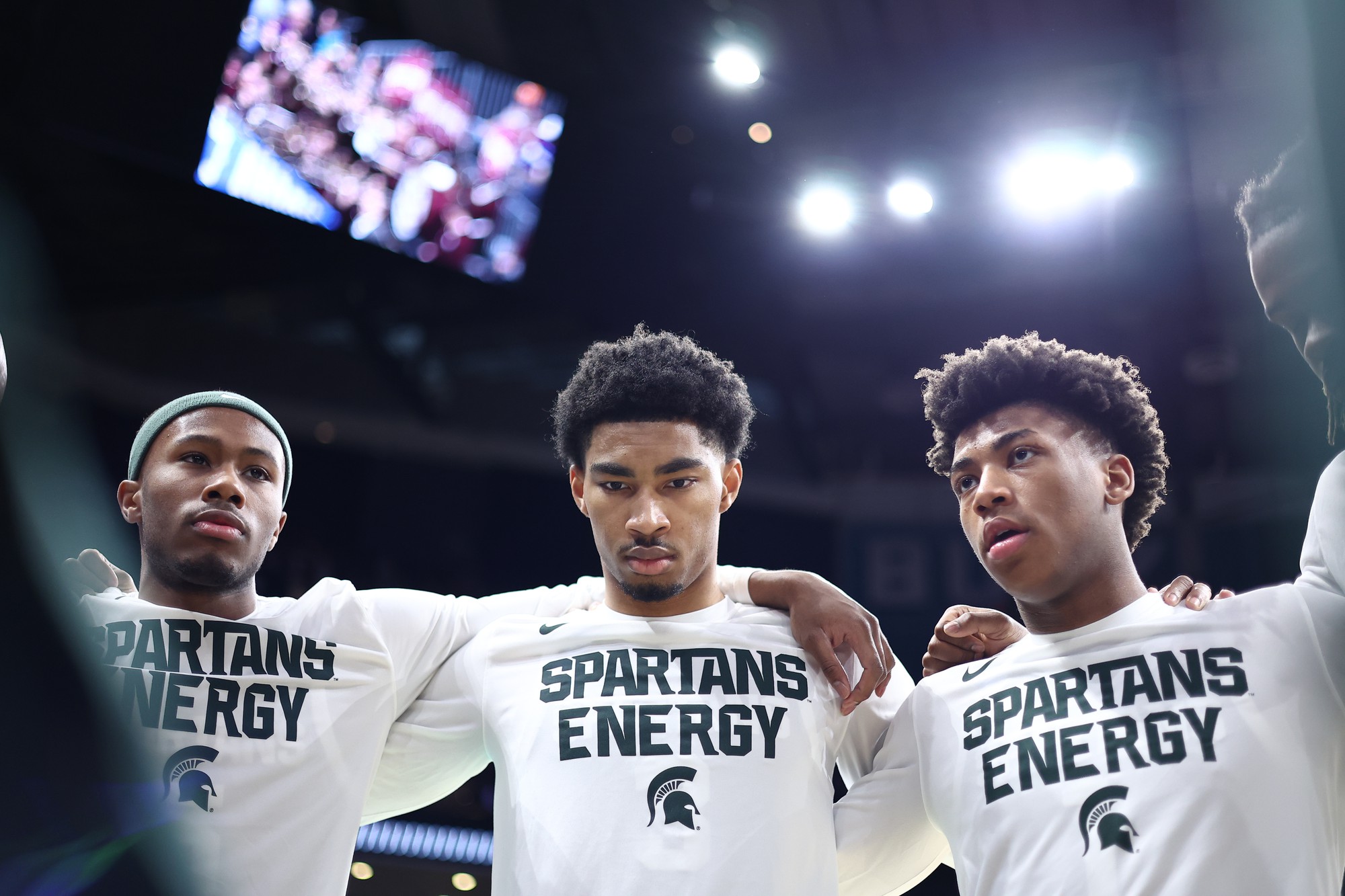 Guards Tre Holloman, Jaden Akins and Jeremy Fears Jr. (left to right) huddle during a practice session. Fears was out for most of the season with a shoulder injury. (Courtesy of MSU Athletic Communications)