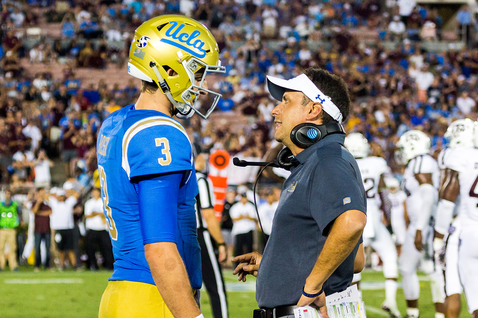 Then-offensive coordinator Jedd Fisch (right) speaks with former quarterback Josh Rosen (left) in 2017. Fisch was hired as Washington's head coach ahead of the 2024 season. (Daily Bruin file photo)