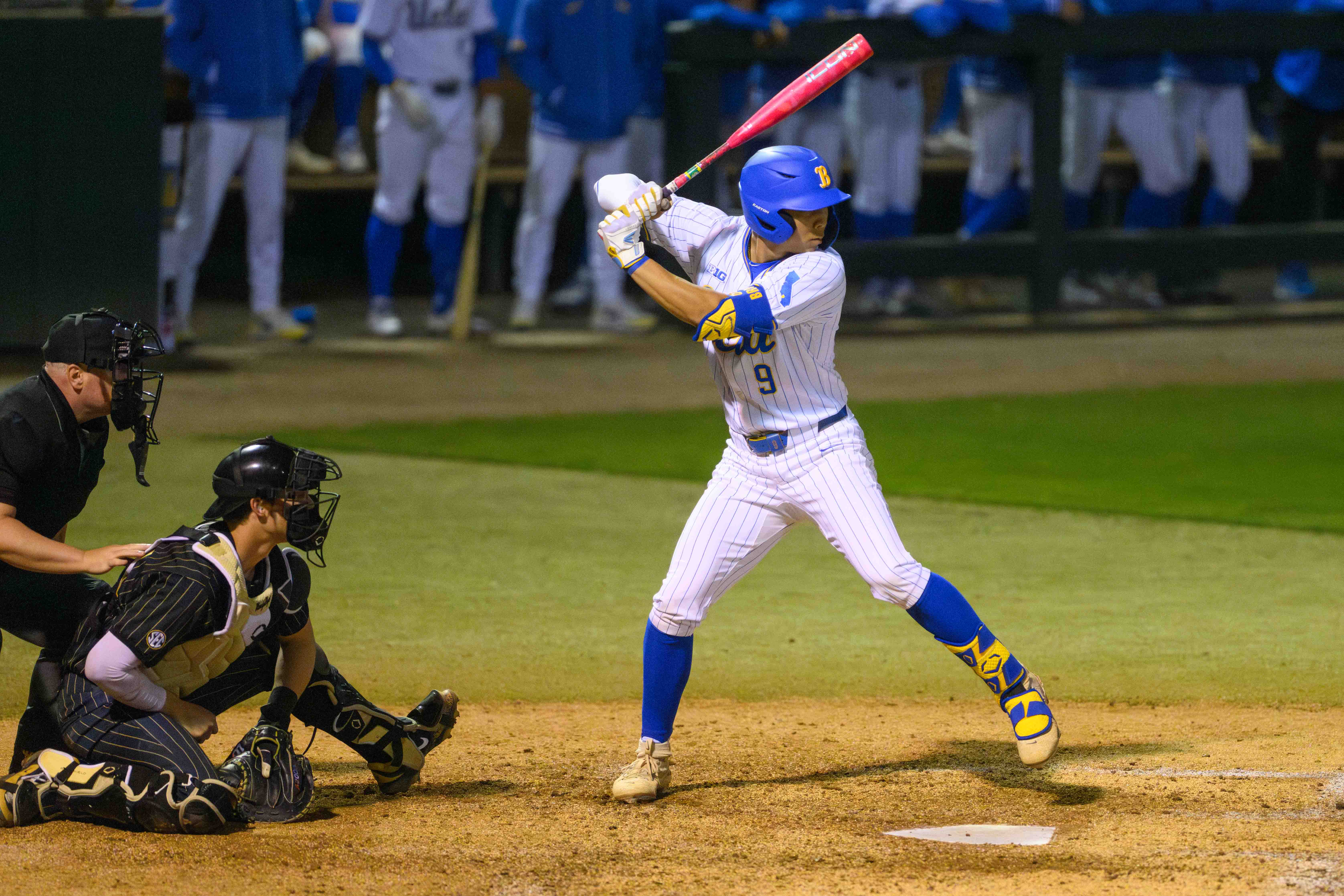 Cameron Kim strides into his swing. The sophomore designated hitter recorded one of the Bruins' three hits Friday and drove in one of three runs with a sacrifice fly. (Rylan Riccabona/Daily Bruin)