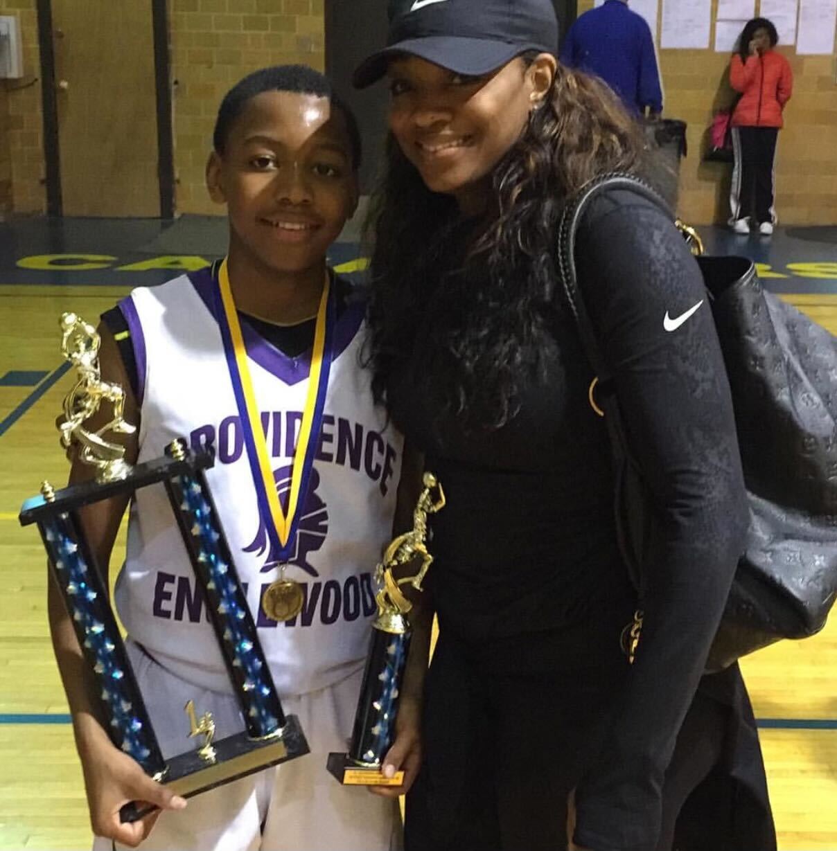As a sixth grader, Mack smiles for a photo with Johnson after winning the city championship with the seventh and eighth grade team. Mack hit a buzzer beater to clinch the title. (Courtesy of Leslie Johnson)