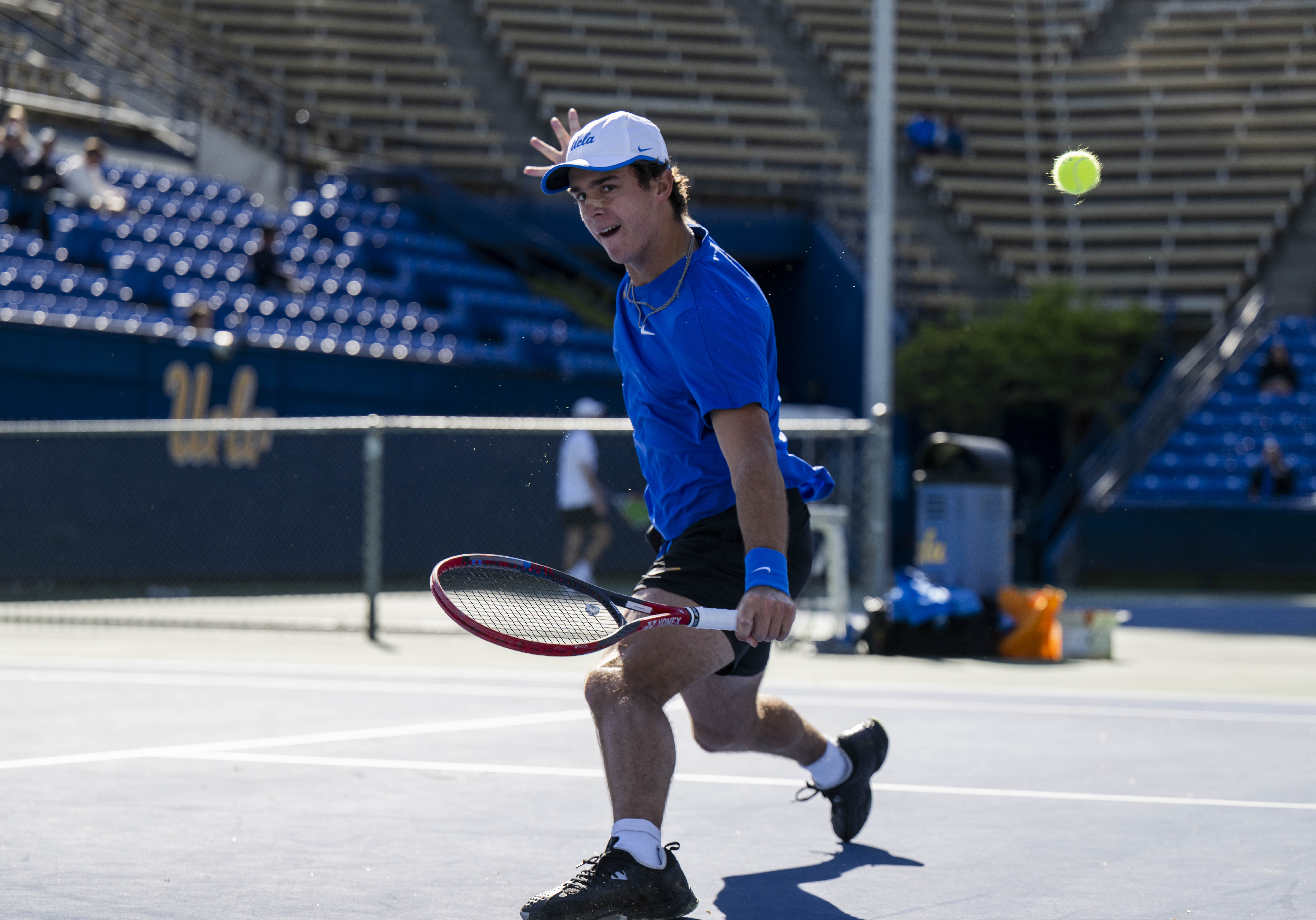 Freshman Kaylan Bigun backhands a ball at the Los Angeles Tennis Center. (Brianna Carlson/Daily Bruin staff)