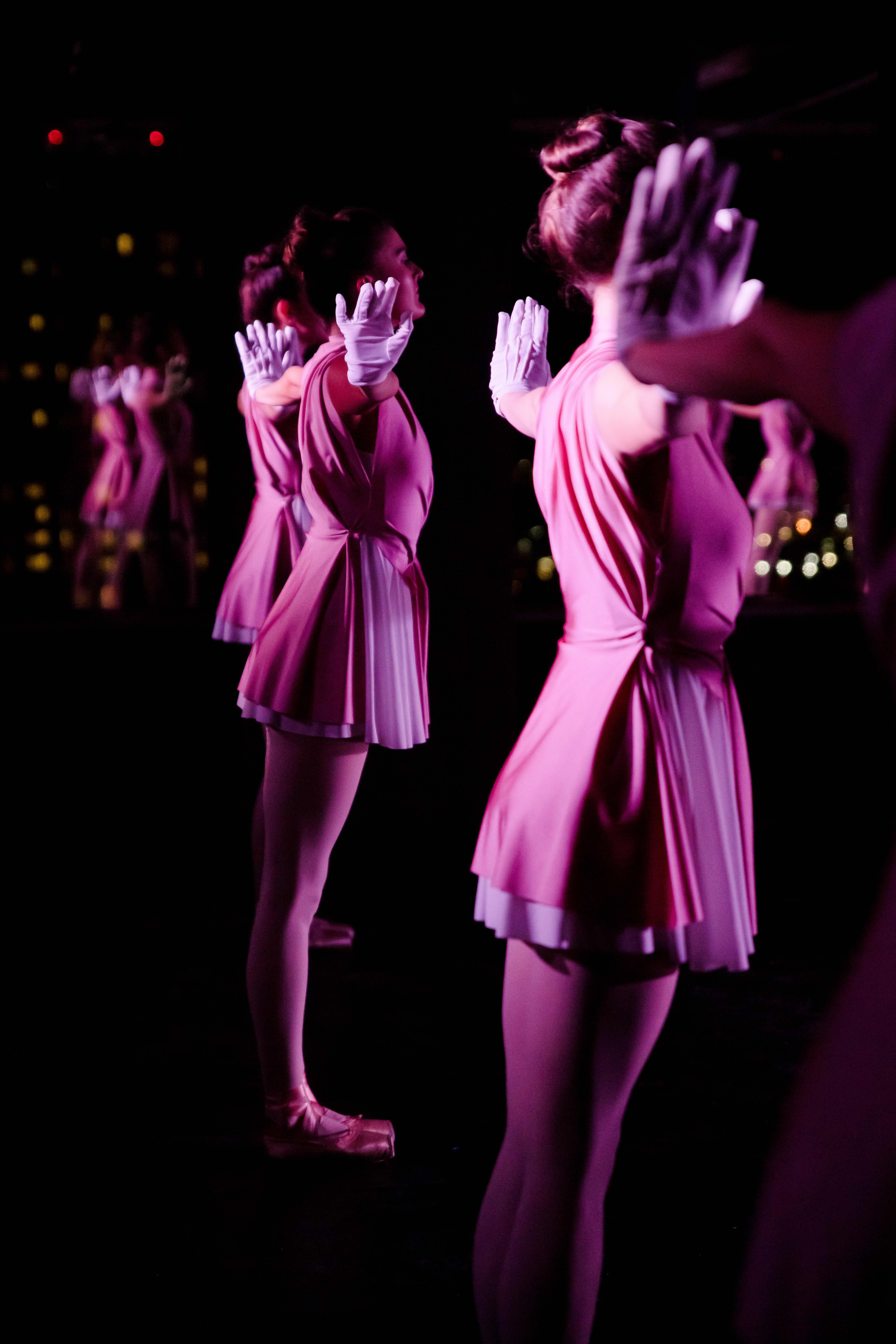 Several dancers perform onstage during a sequence of the American Contemporary Ballet&squot;s production of "Homecoming" while wearing pink outfits. The ballet was created by the dance company&squot;s founder, Lincoln Jones, who collaborated on the show&squot;s music with Michael Arrom and Ana Barreiro. (Courtesy of Mary Joyce)