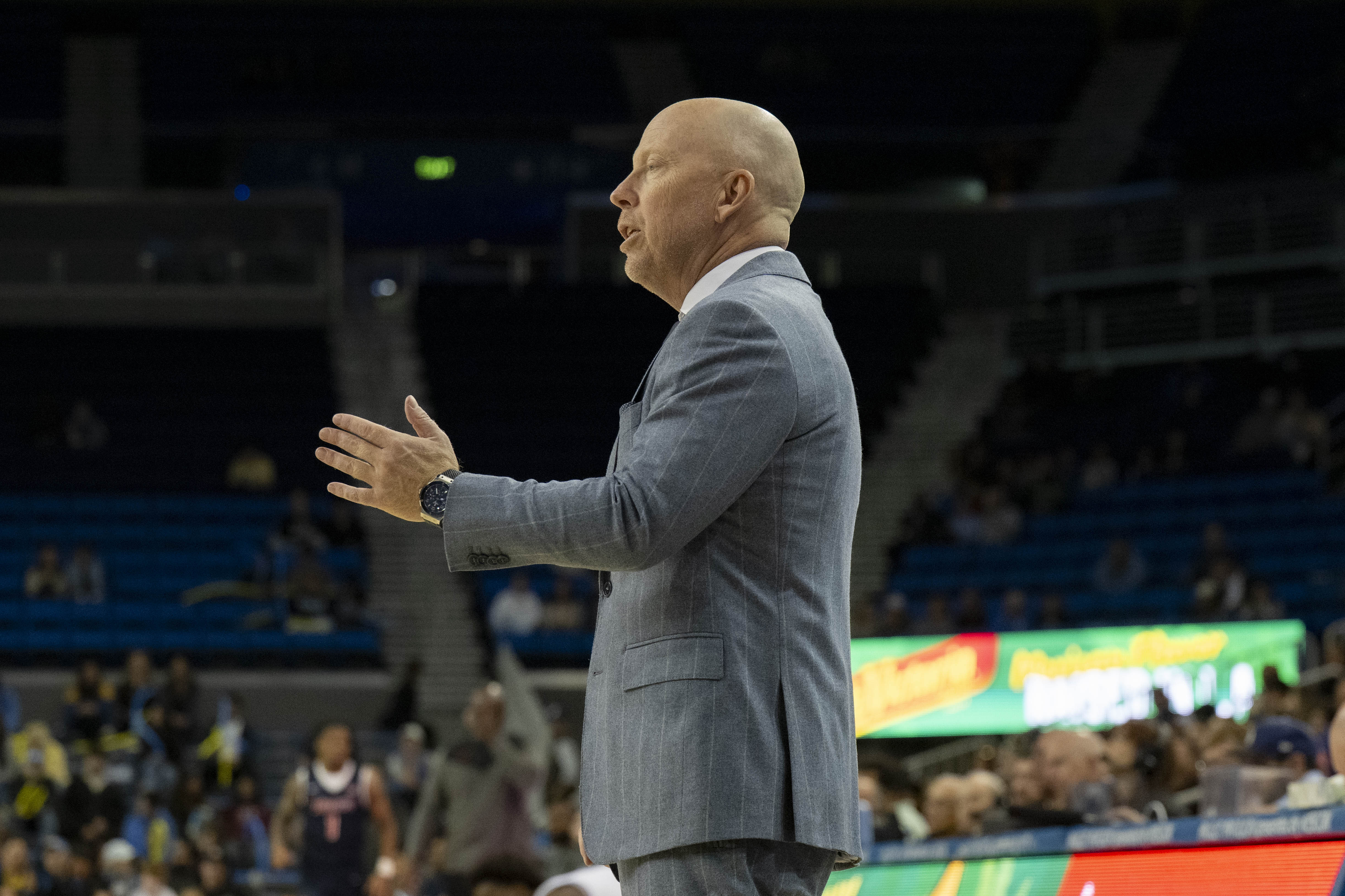 Mick Cronin stands on the sidelines of Pauley Pavilion. UCLA men's basketball coach has frequently spoken to the difficulties the transition to the Big Ten has posed for his team this season. (Michael Gallagher/Assistant Photo editor)